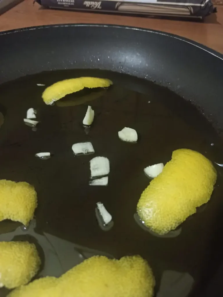 lemon peels and garlic in a saucepan