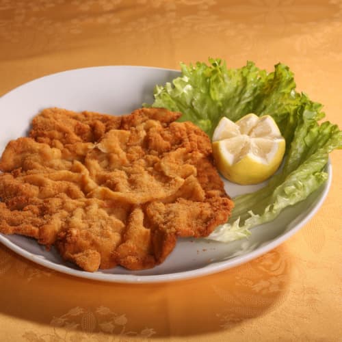 a veal milanese on a plate