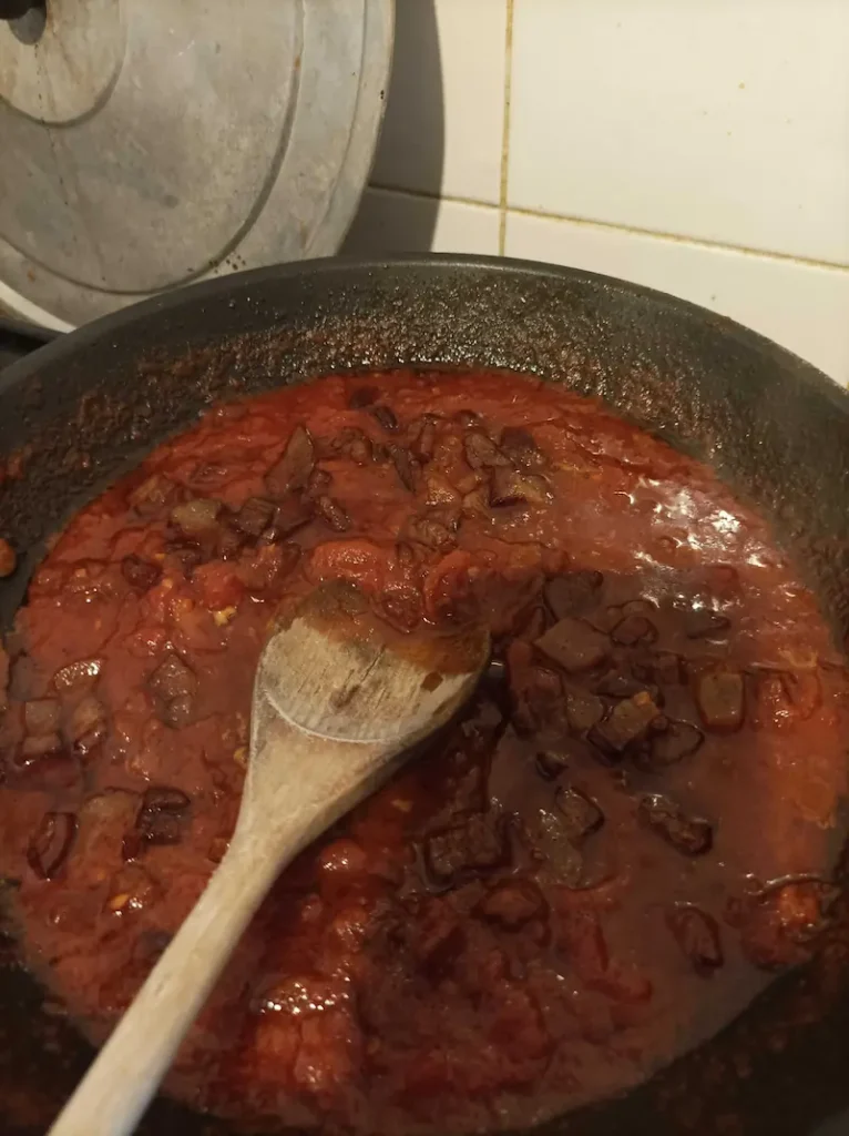 amatriciana sauce in iron saucepan