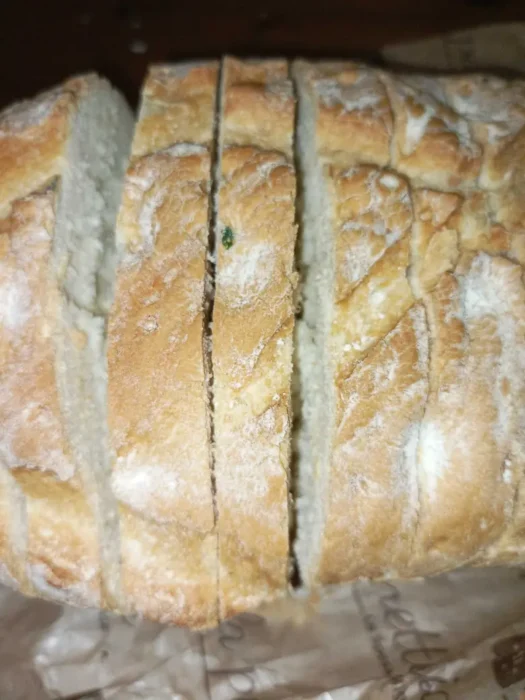 a loaf cut into slices that are not completely separated from each other