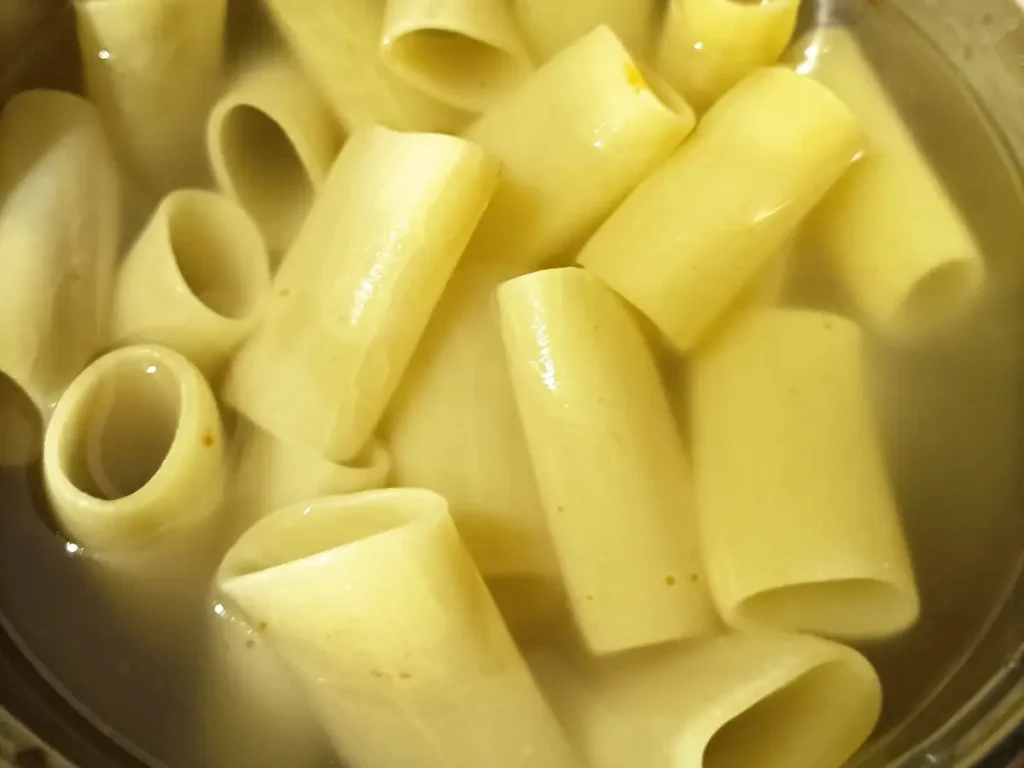 paccheri pasta cooking in water