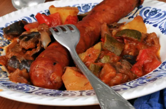 ratatouille served with wild italian sausage on a plate