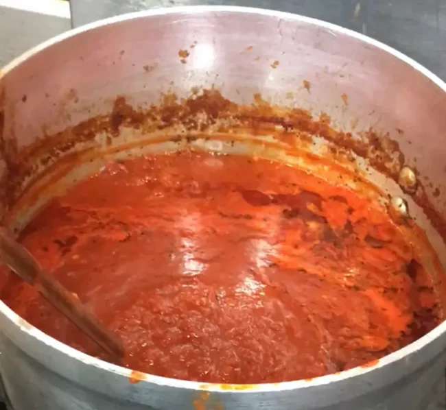 Italian gravy (or Sunday Sauce, if you prefer) in a large pot, ready to be simmered for some hours