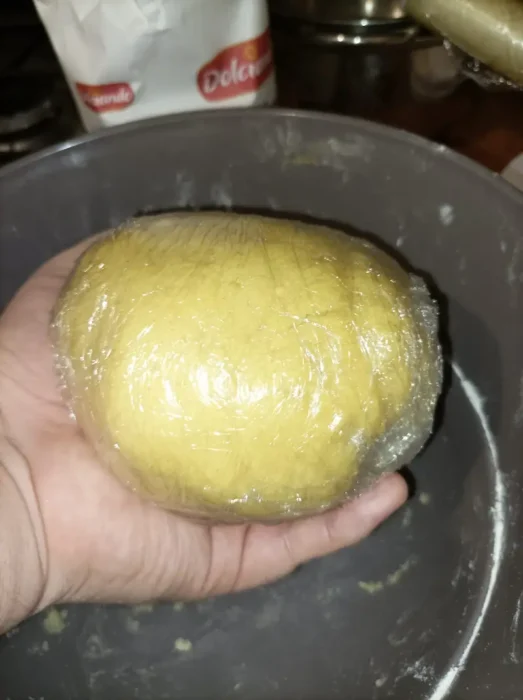 shortcrust pastry ball covered in plastic wrap