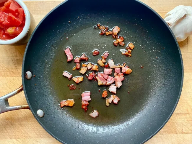 browning pancetta in a saucepan