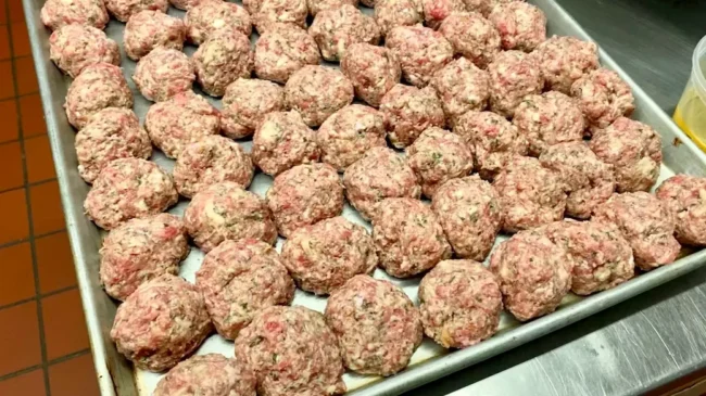 a tray of meatballs made from frozen pork