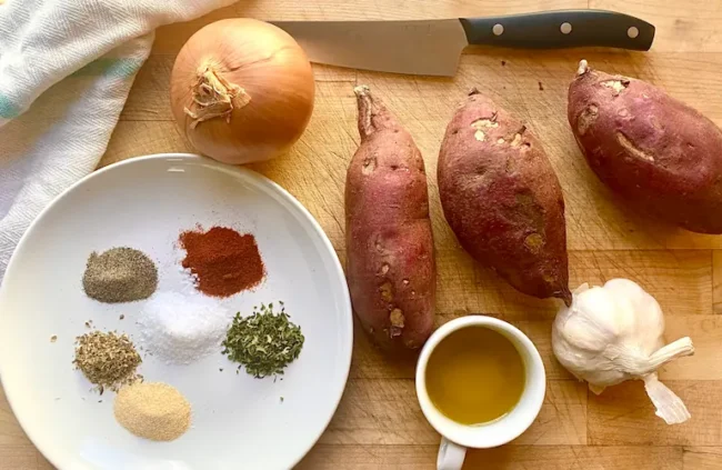 the ingredients for this sauteed sweet potatoes recipe on a working surface