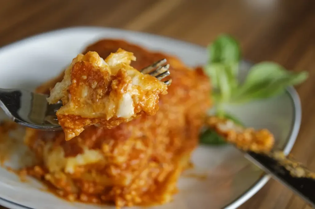 a slice of lasagna, the most typical food from bologna