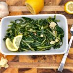 Finished dish of dandelion greens cooked with olive oil, garlic and lemon