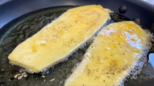 eggplant frying in olive oil