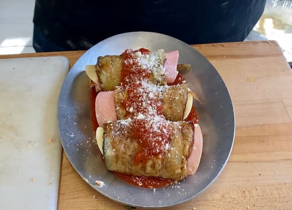 a plate of eggplant involtini before baking