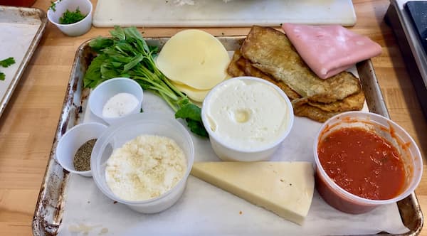 a plate with all the ingredients for eggplant involtini