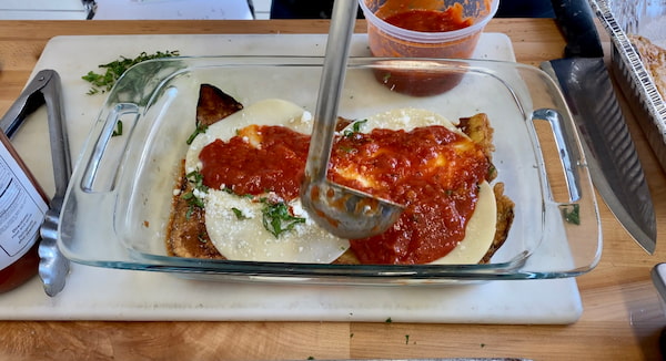 a new sauce layer on our eggplant parmigiana