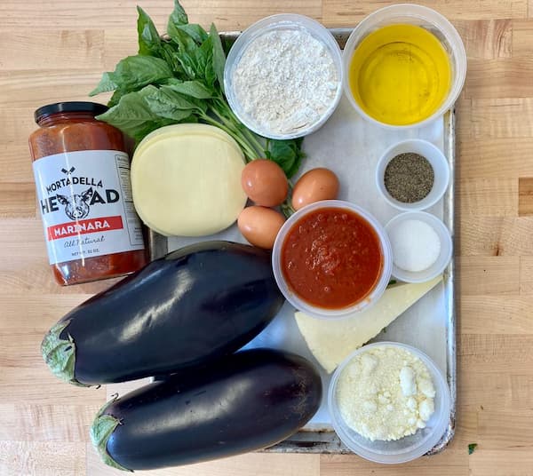 a plate with all the ingredients to make baked eggplant parmigiana