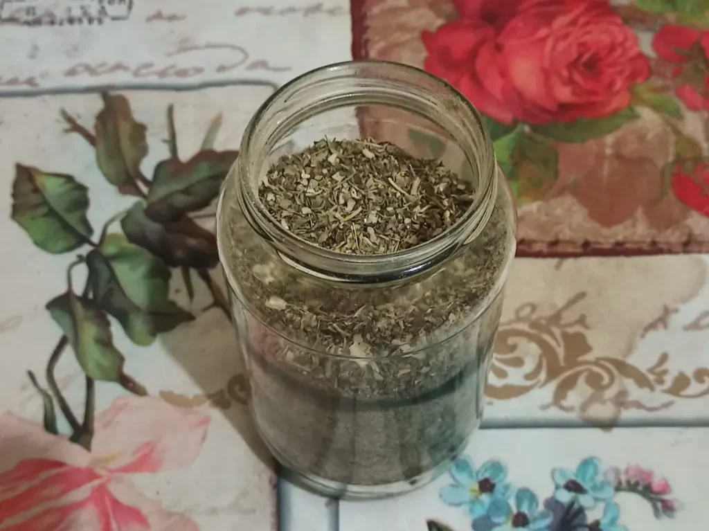 an open jar of homemade italian seasoning