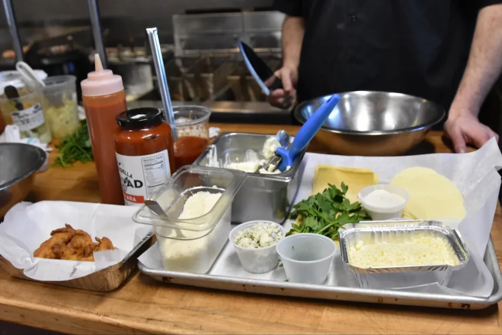 this image shows the ingredients for this buffalo chicken lasagna recipe