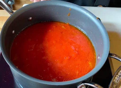 a pot of tomato sauce ready to be put on some spaghetti