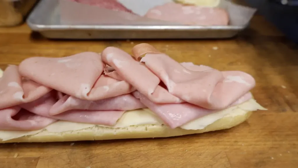 how to make an italian sub sandwich step 3: mortadella on ham