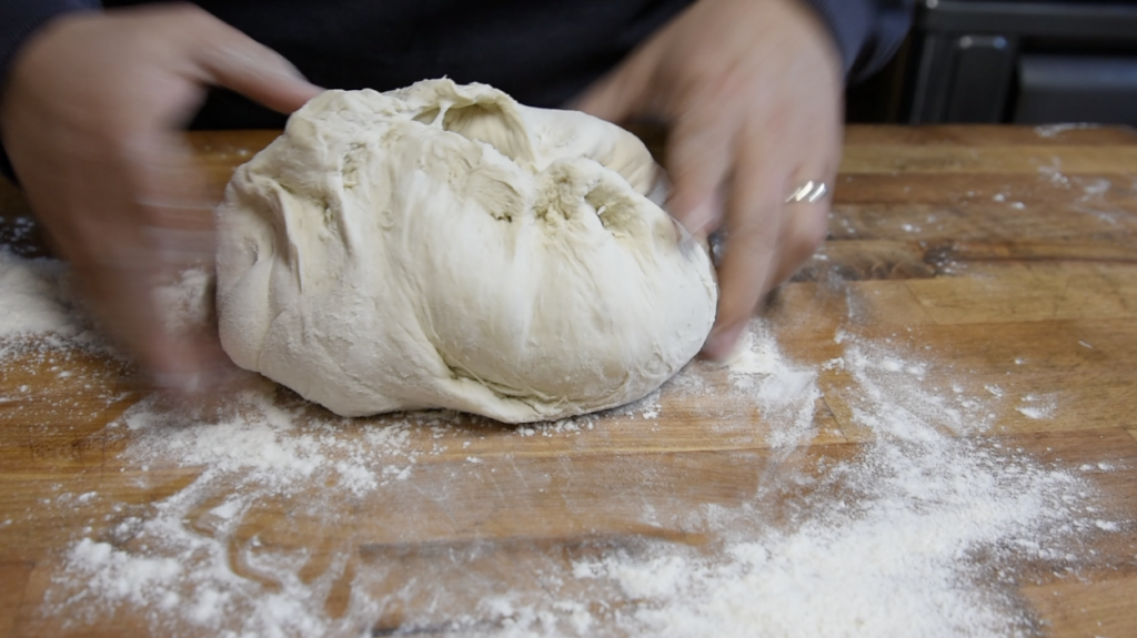 folding the roman pizza dough again