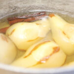 a pot full of poached pears made with this recipe