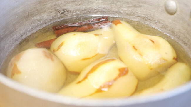 a pot full of poached pears made with this recipe