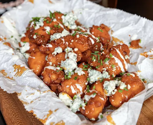 a portion of chicken wings for 2 people