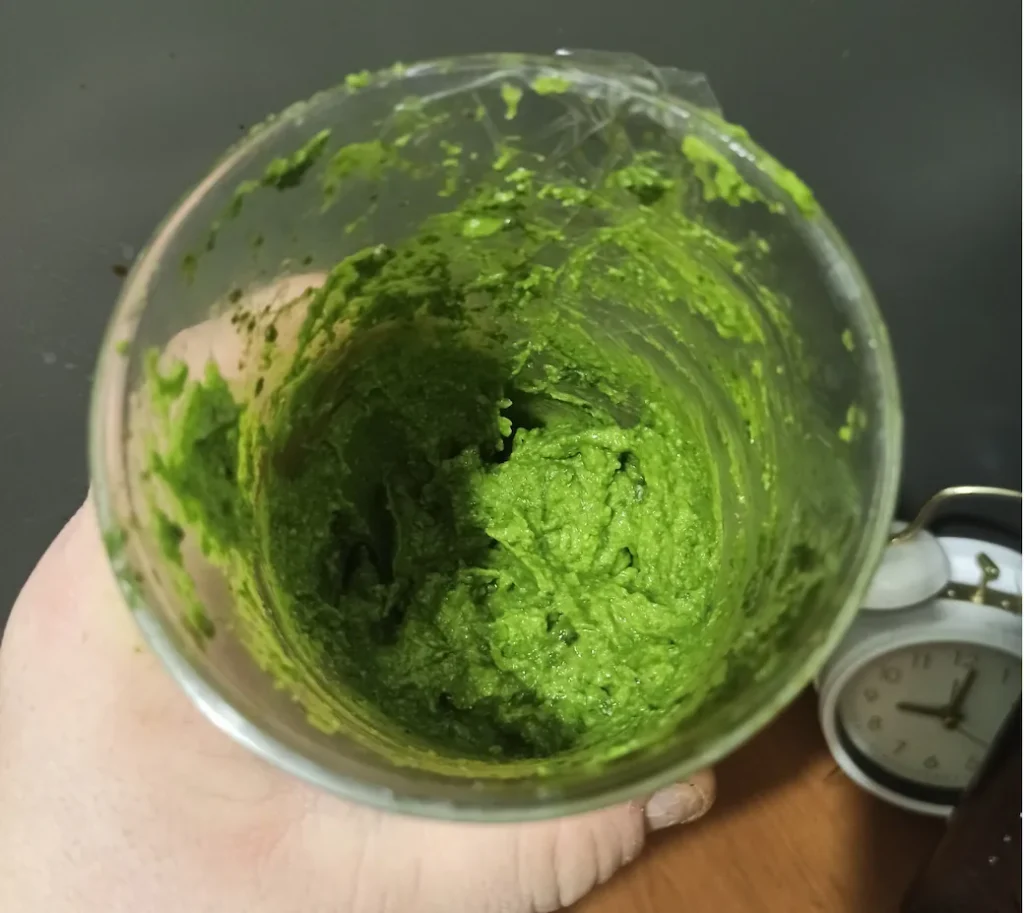 a picture of how your pesto should look if you followed this recipe. It has a bright green color and a nice, creamy consistency.