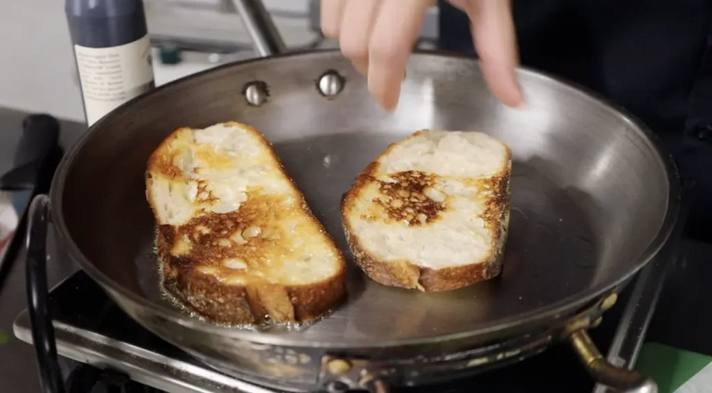 the first step for this mozzarella bruschetta recipe is toasting the bread