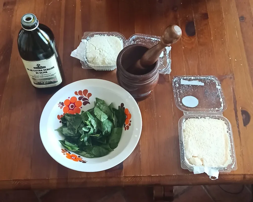 this picture shows all the ingredients for this pesto recipe without pine nuts