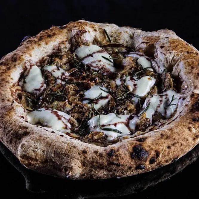 a gourmet pizza made at Seu Pizza Illuminati in Rome