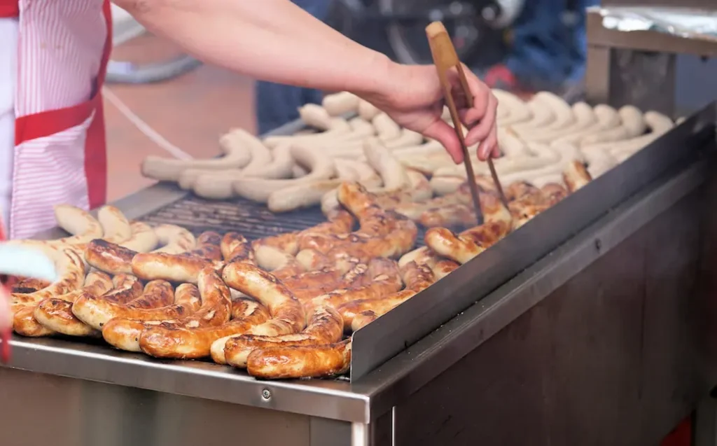 bratvurst vs sausage on a grill