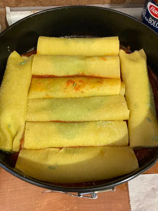 rolled cannelloni in a baking dish