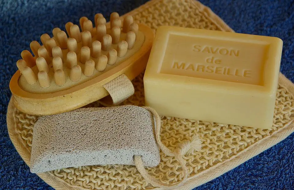 a piece of marseille soap aside with a brush