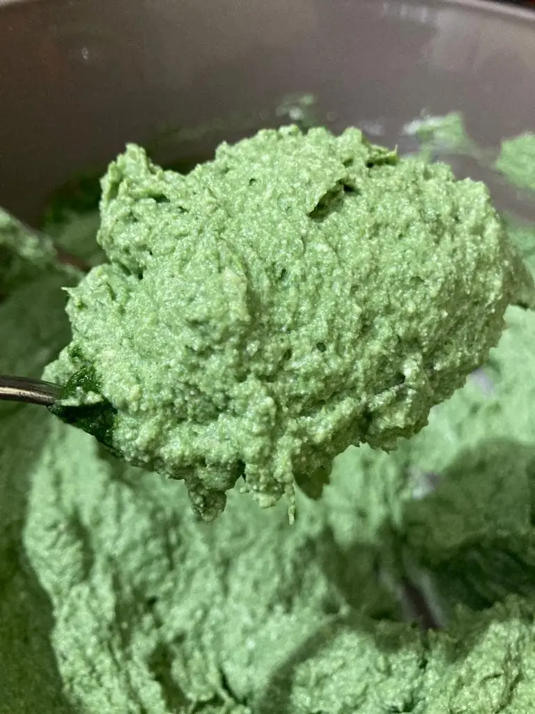 detail of a spoon full with the ricotta & spinach mix