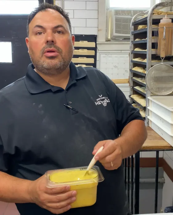 Sebby with a food container full with honey mustard