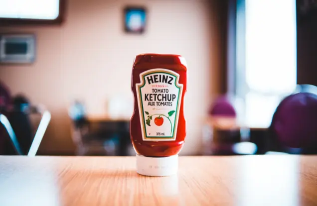 a bottle of ketchup on a table