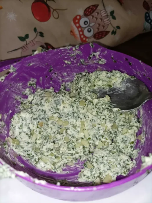 the garlic butter mixture in a small purple bowl