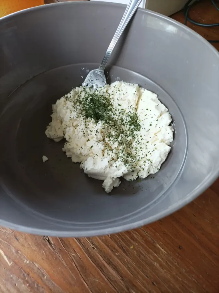ricotta with dried herbs in a bowl