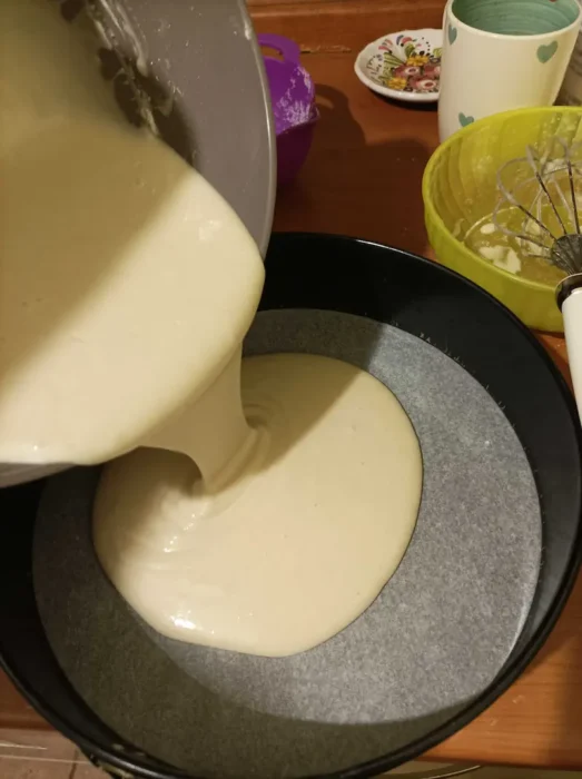 pouring the mixture onto a springform pan
