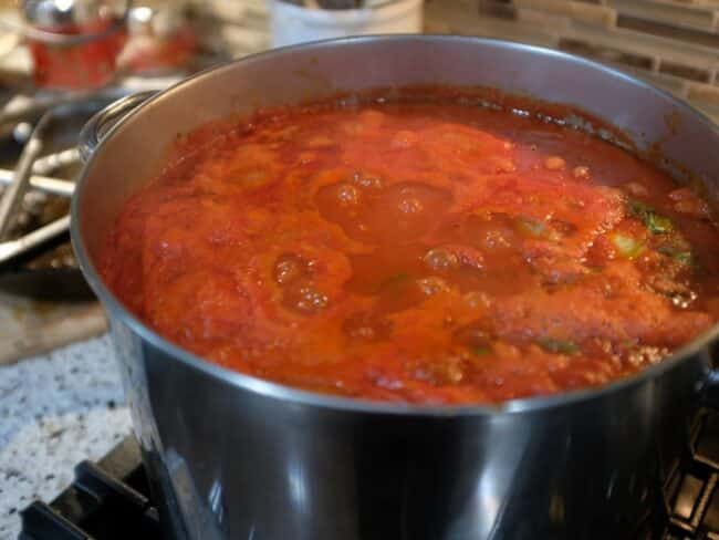 italian gravy simmering in a big pot