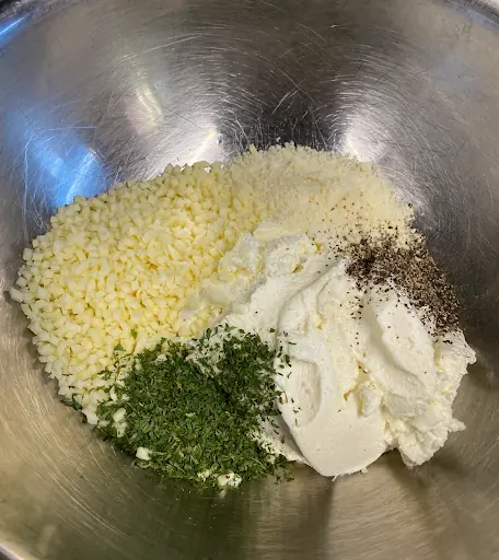 the ingredients for a classic ricotta cheese mixture in a bowl