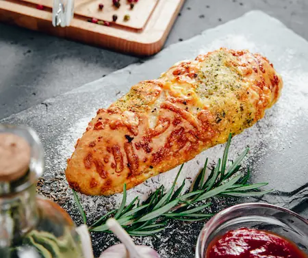 a finished Italian herb and cheese bread roll