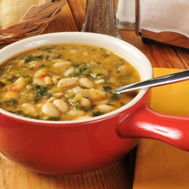 Finished pot of the warm, Italian cannellini bean soup recipe simmering on the stove in all of the goodness.