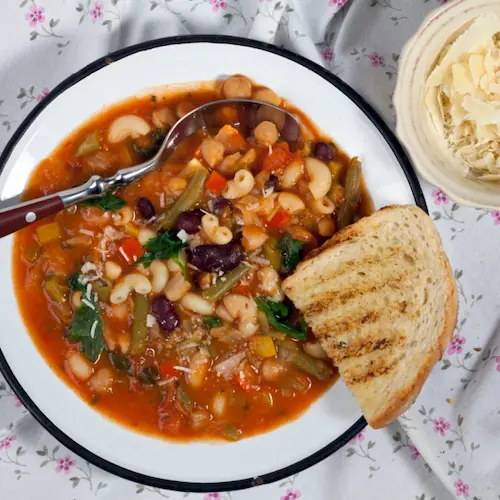 a tasty italian white bean soup with crusty bread on the side