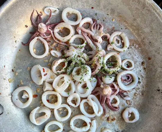 sauteeing squid in frying pan