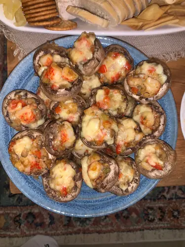 mushrooms stuffed with gouda cheese and crabs are a perfect seafood appetizer for the holiday season