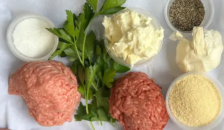 the ingredients for meatballs without eggs on a table