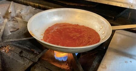 heating tomato sauce before cooking frozen meatballs