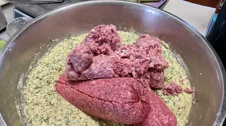 making meatballs for 50 people in a big, big bowl