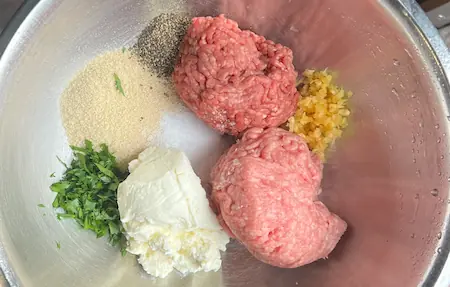 the meat mixture, ricotta and breadcrumbs in a large bowl